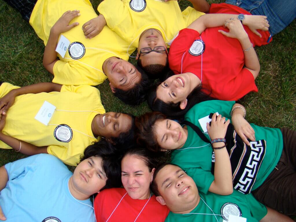 CBSI participants lying on the ground looking up at the camera