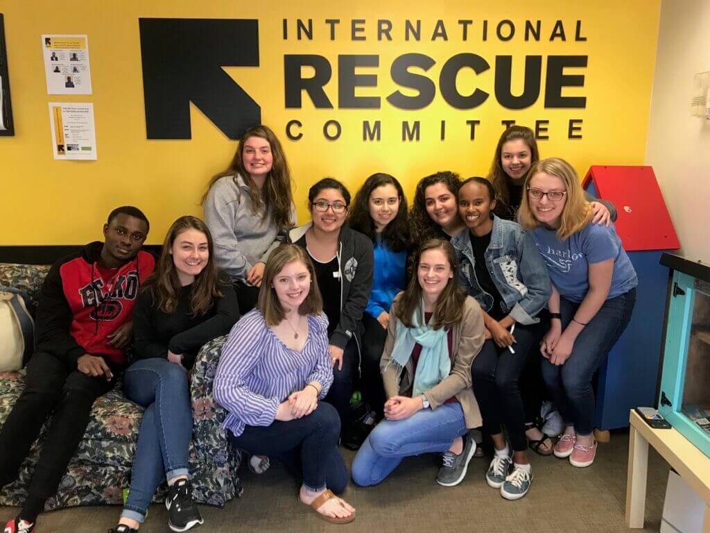 Ayat poses with a group of her peers at International Rescue Committee.