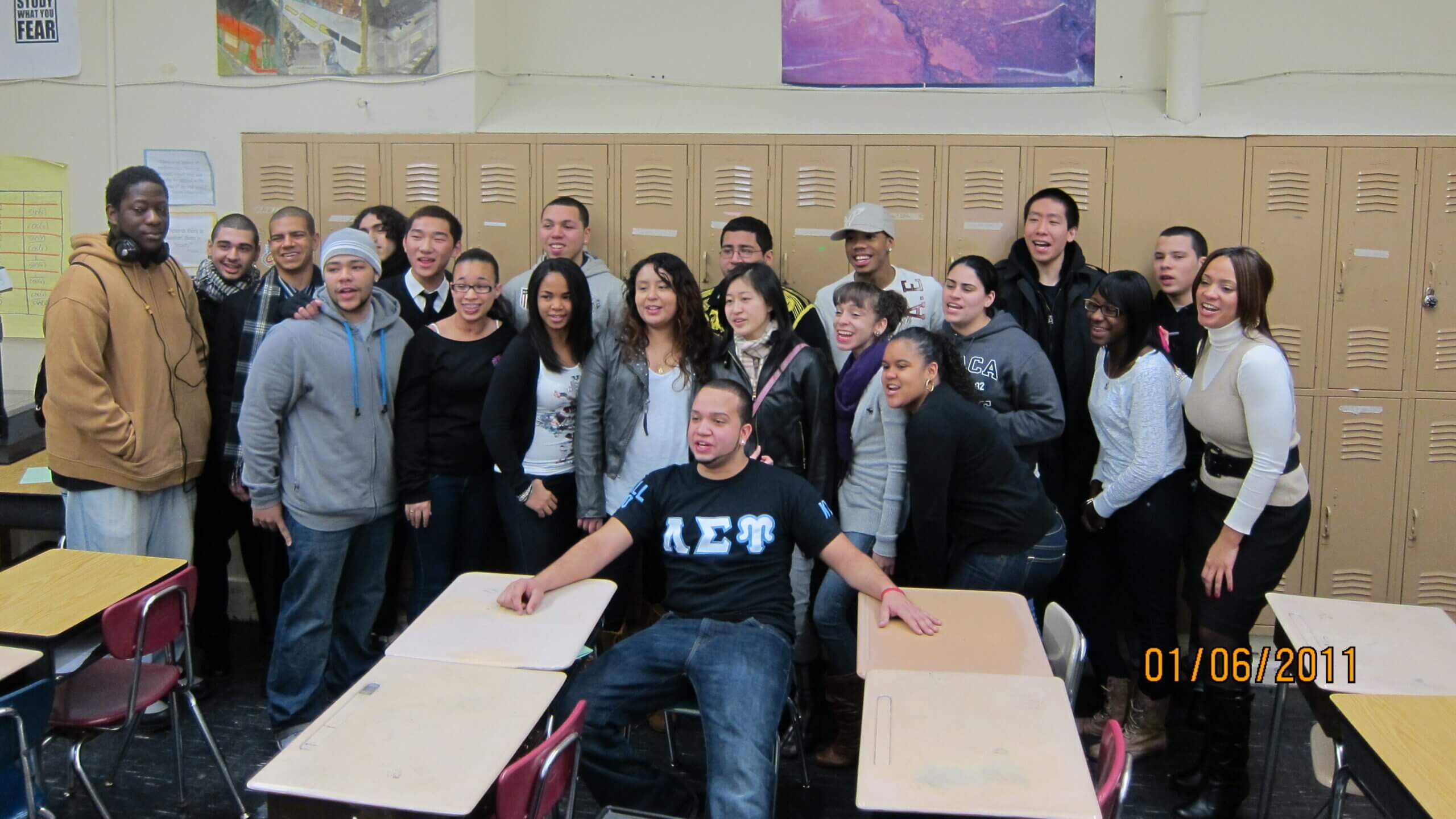 CBI students in 2011 take a picture in front of lockers with their director of college counseling