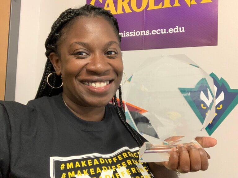 Jahleese holds the Ann Tisch Inspire Award.