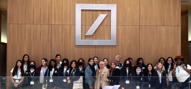 TYWLS Astoria students take a group picture at Deutsche Bank's office in NYC.