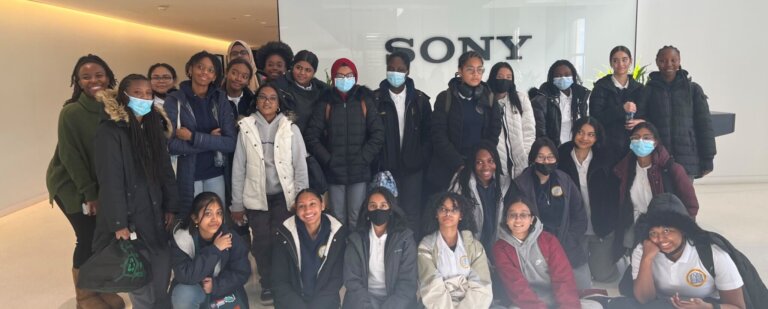 Group of TYWLS students pose in front of SONY sign.