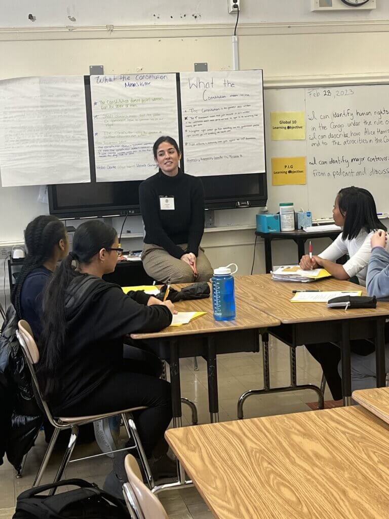 Volunteer speaks to TYWLS Brooklyn students about her work as a lawyer.