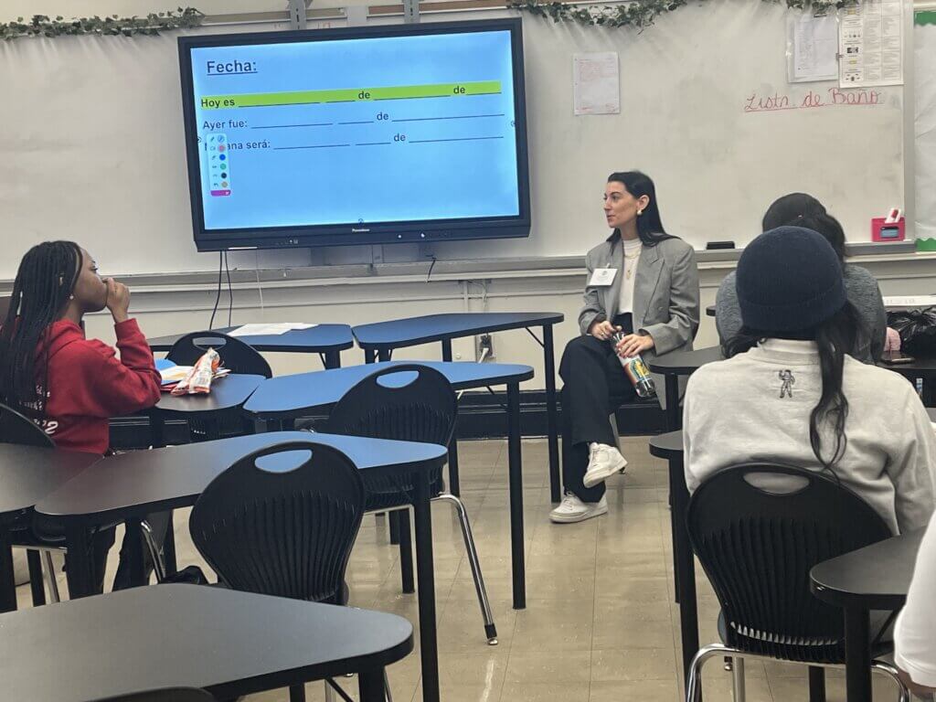 An entrepreneur in the fashion industry talks to students about starting a business.