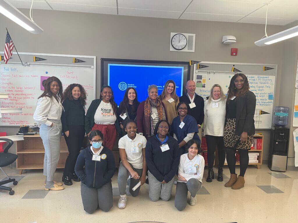 A group of students and volunteers pose at TYWLS Staten Island.