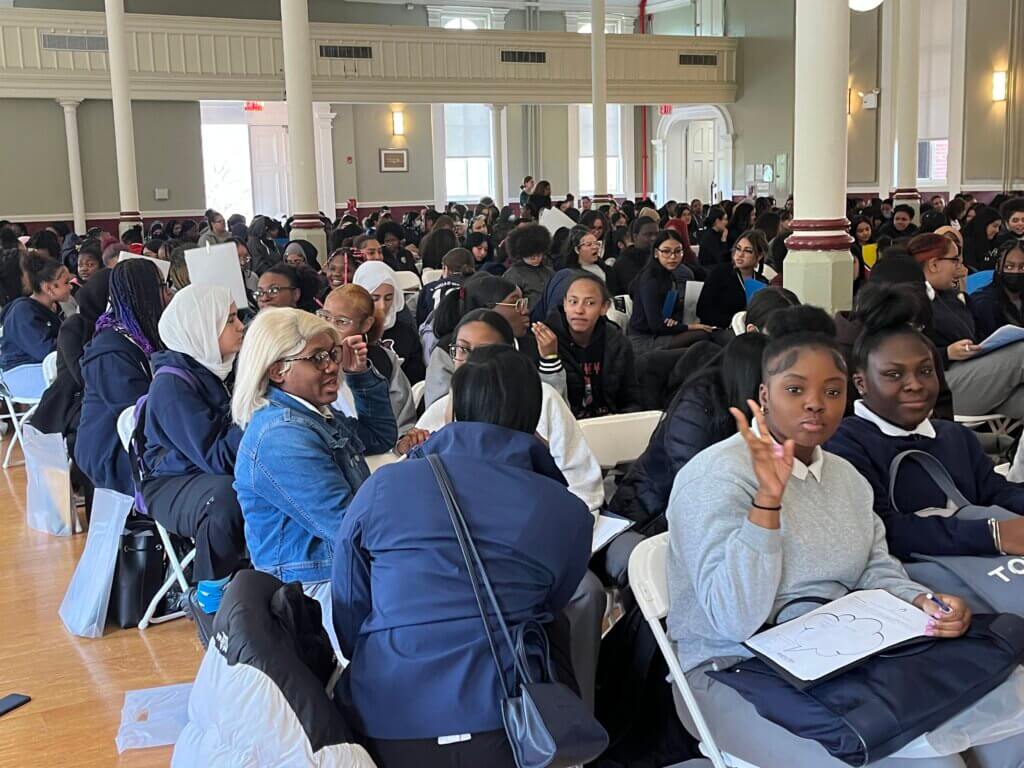 Students break into groups to work on an activity.