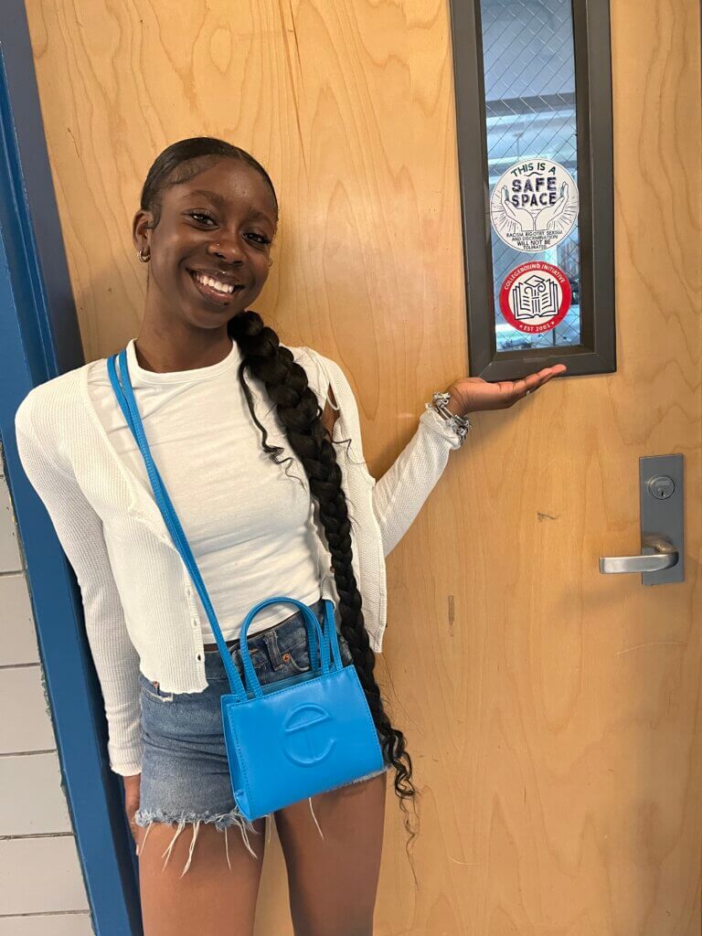 Joy points to a CBI sticker on the door of her DCC's office