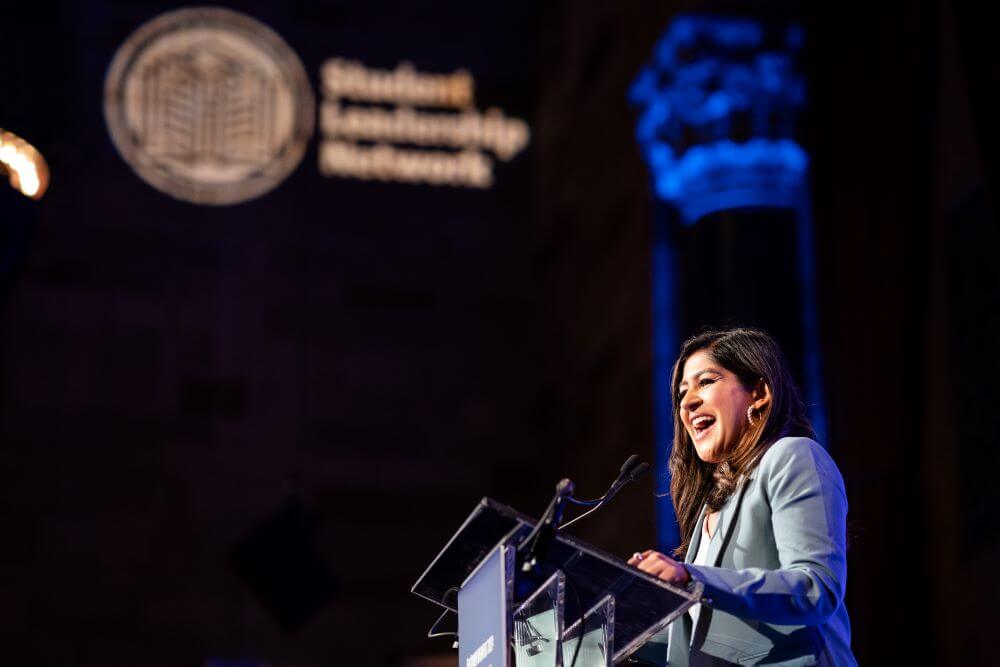 TYWLS alumna Victoria Saha speaks at podium