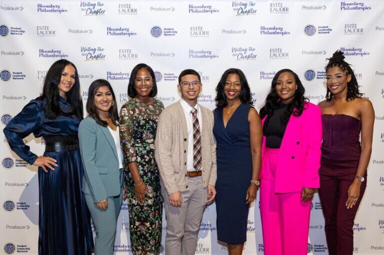 Event honorees and speakers, with CEO Yolonda Marshall, pose in front of Student Leadership Network backdrop