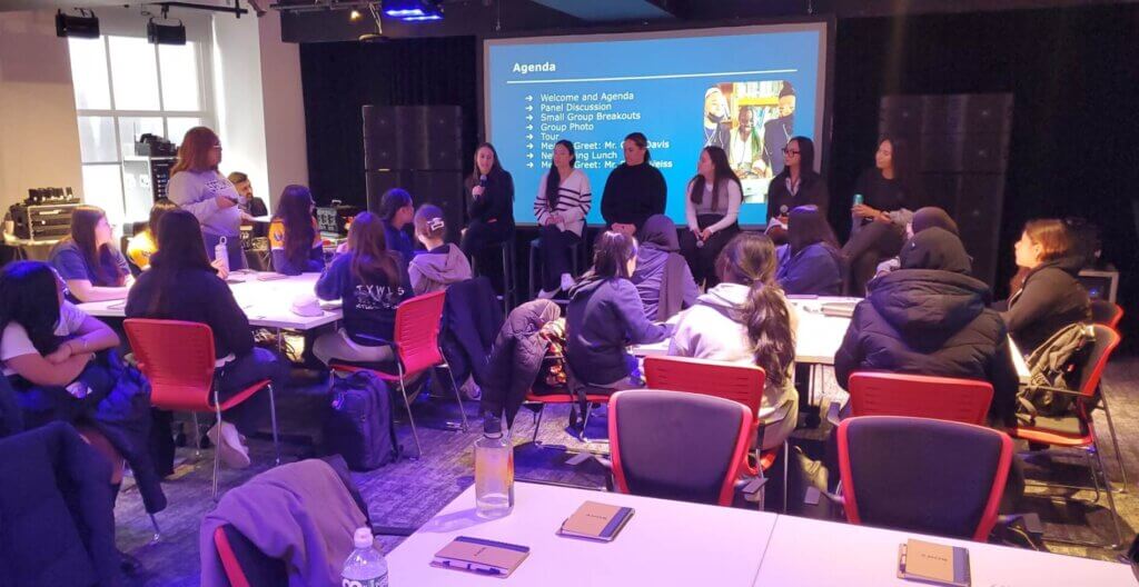 Panel of women employees from Sony sit at front of room, with students seated in the room