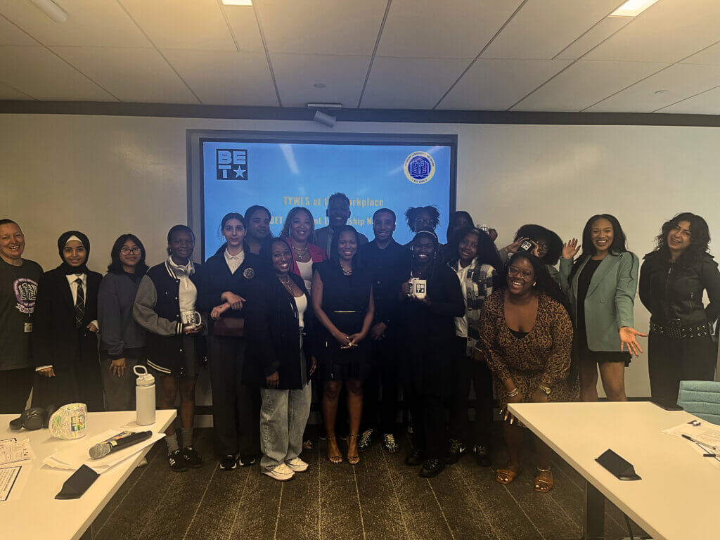 Group photo of adult volunteers from BET Networks and high school students