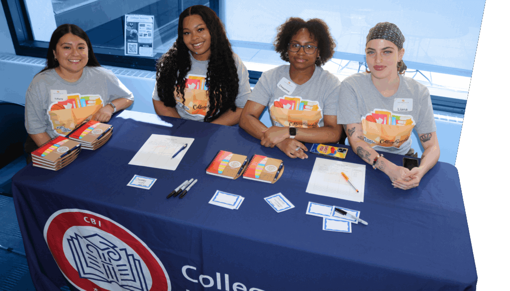 Four alumni volunteers are seated behind the "CollegeBound Initiative" welcome table