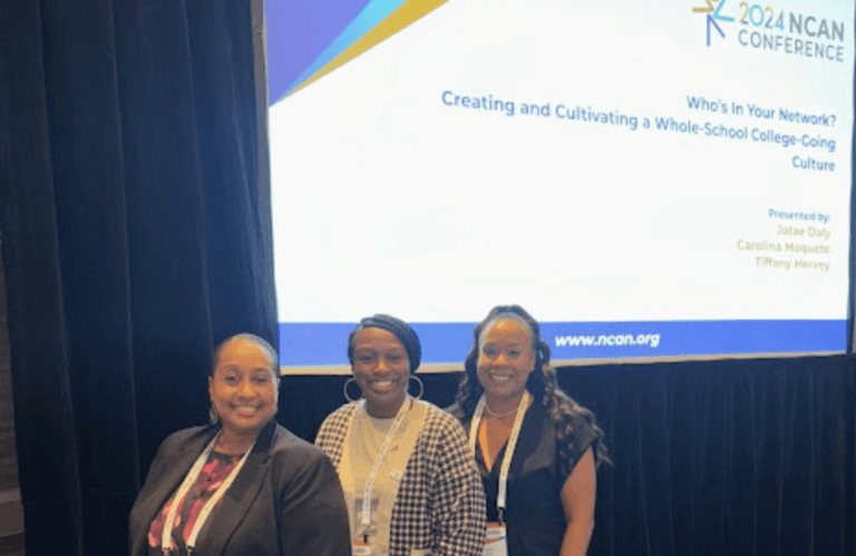 Three women stand smiling in front of a presentation screen at the 2024 NCAN Conference, where the session topic and presenters’ names are displayed.