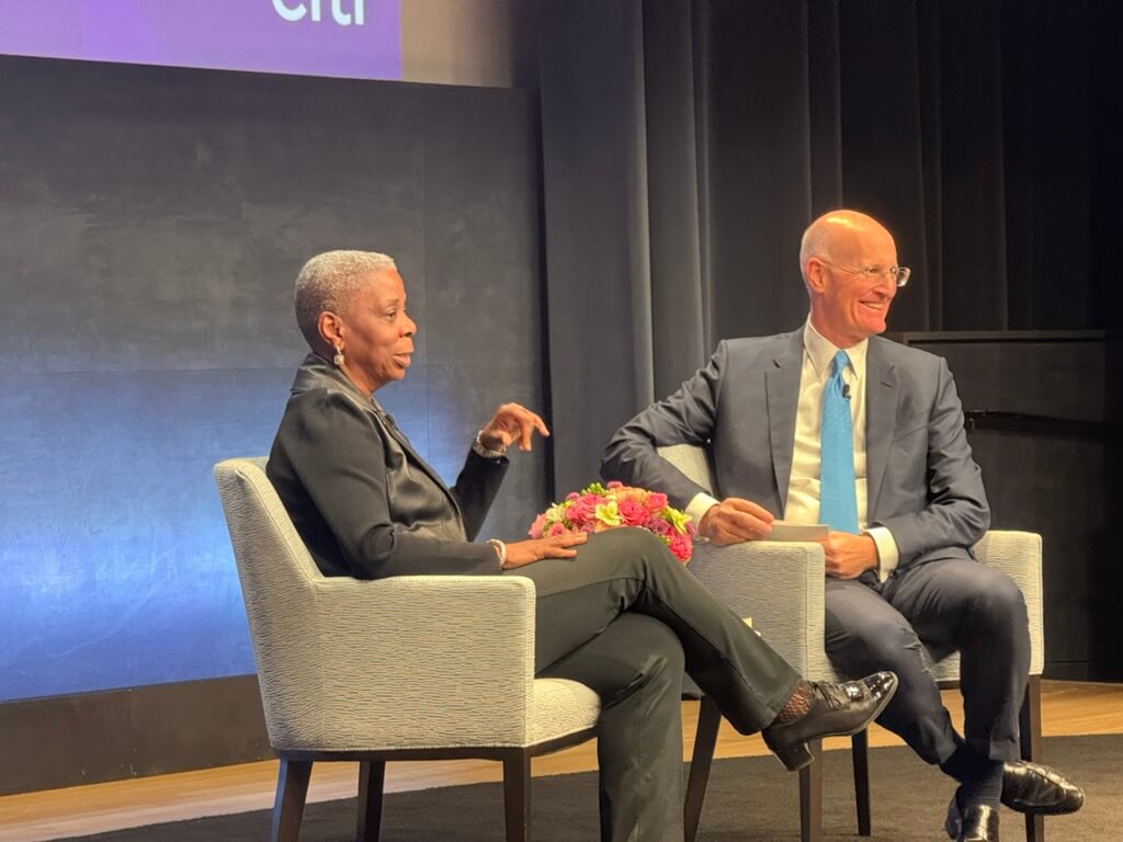 Ursula Burns and Andy Sieg are seated on a stage