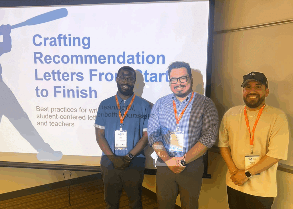 Three men stand in front of a projected presentation slide titled Crafting Recommendation Letters From Start to Finish in a conference room.